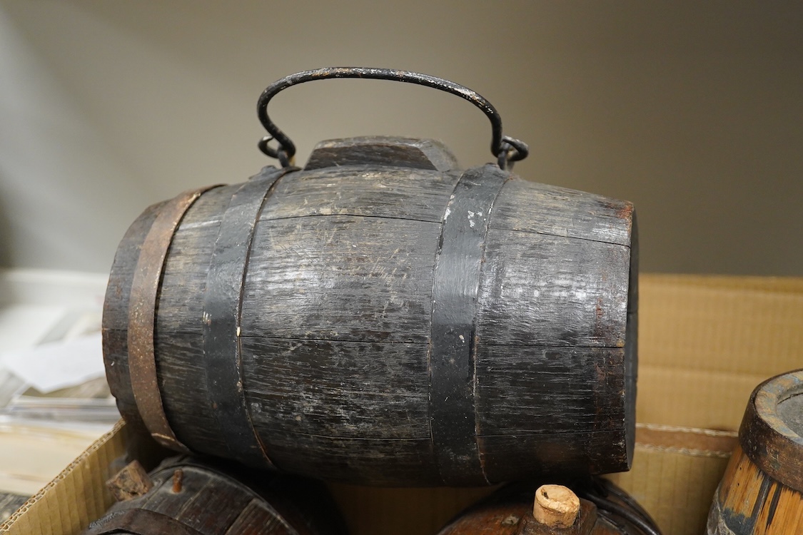 A collection of 19th and 20th century Costrels, some coopered oak, largest 27cm wide